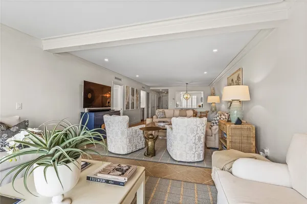 a living room with furniture and a lamp