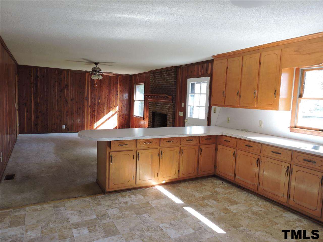 5119 Green Riley Road Rougemont, NC 27572 - Photo 5 of 25 a kitchen with granite countertop a sink cabinets and a stove