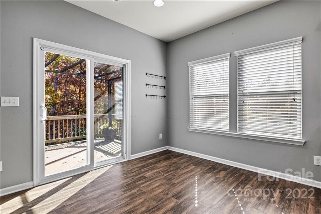6170 Durango Way Denver, NC 28037 - Photo 13 of 38 a view of an empty room with wooden floor and a window