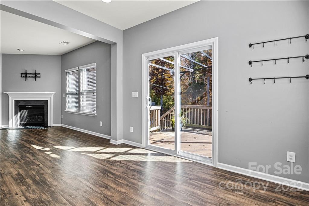 6170 Durango Way Denver, NC 28037 - Photo 14 of 38 a view of an empty room with wooden floor and a window