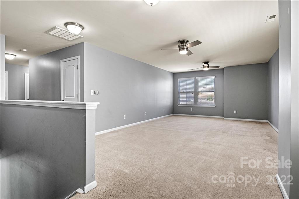 6170 Durango Way Denver, NC 28037 - Photo 16 of 38 a view of an empty room with a window