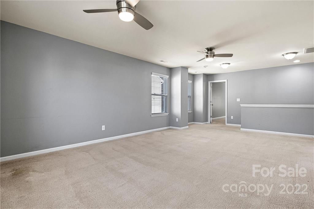6170 Durango Way Denver, NC 28037 - Photo 17 of 38 a view of an empty room with a ceiling fan