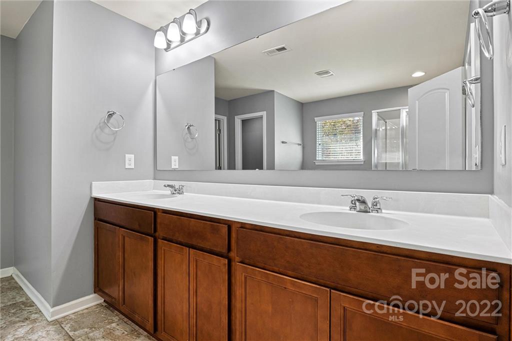 6170 Durango Way Denver, NC 28037 - Photo 20 of 38 a bathroom with a sink double vanity and a mirror