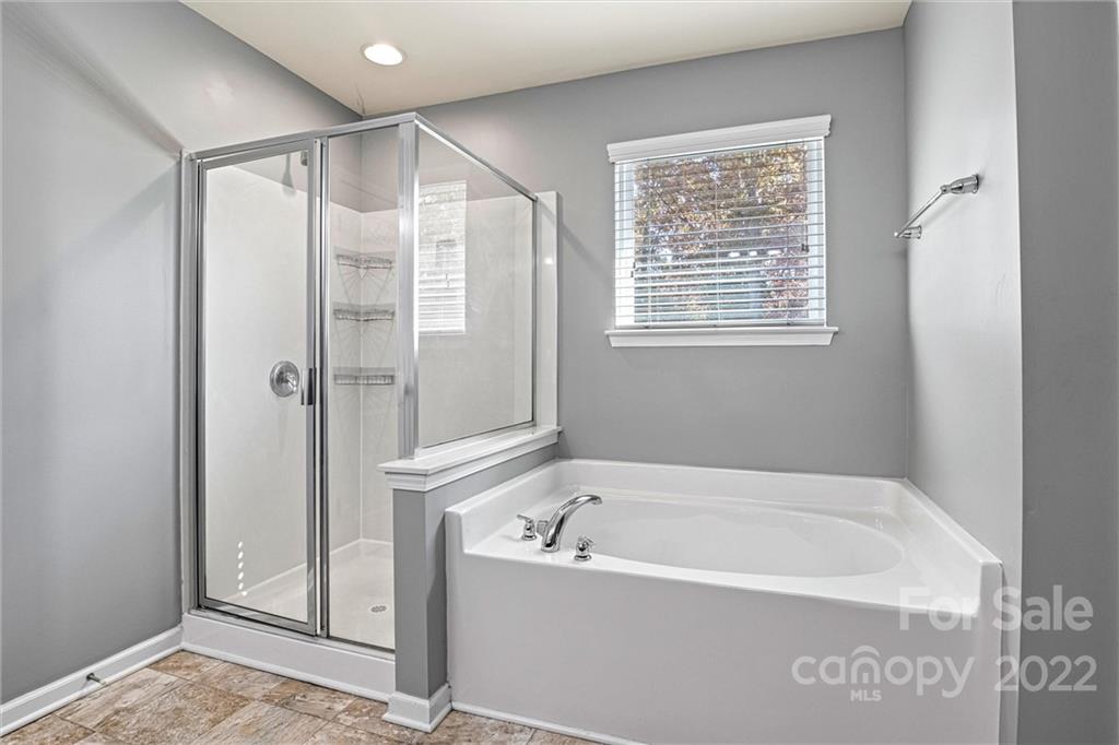 6170 Durango Way Denver, NC 28037 - Photo 21 of 38 a bathroom with a bathtub and a shower