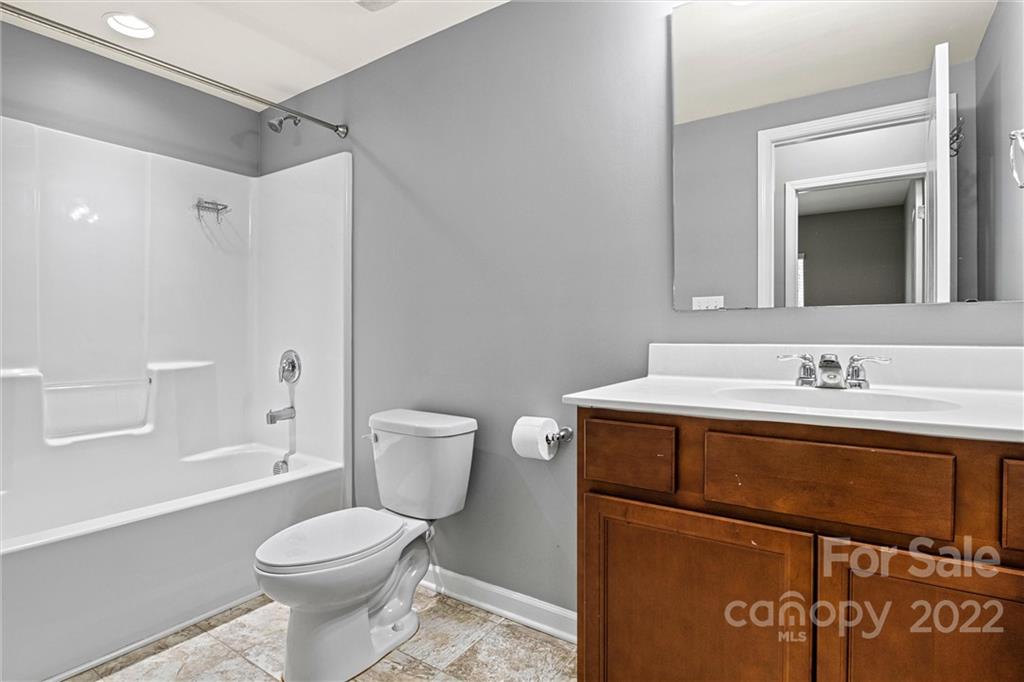 6170 Durango Way Denver, NC 28037 - Photo 26 of 38 a bathroom with a sink a toilet and shower