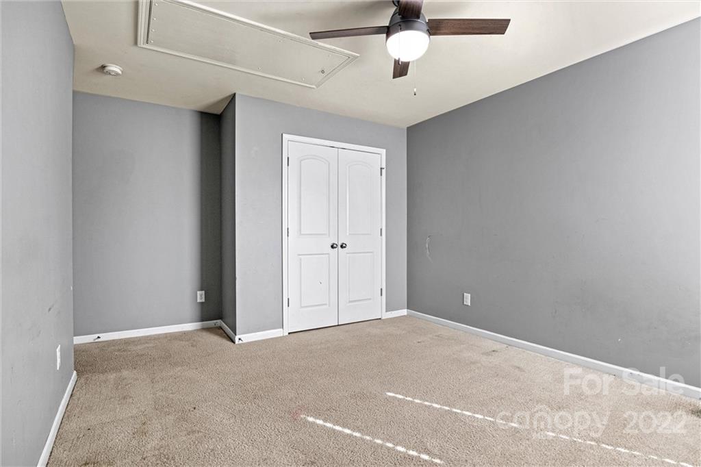 6170 Durango Way Denver, NC 28037 - Photo 28 of 38 a view of an empty room with a ceiling fan