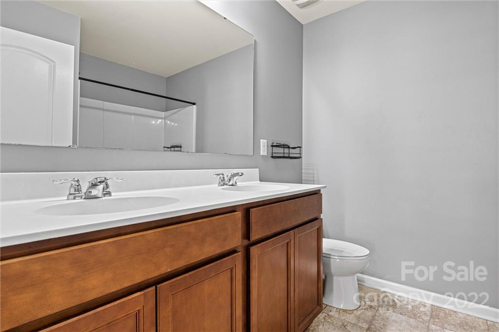 6170 Durango Way Denver, NC 28037 - Photo 29 of 38 a bathroom with a sink toilet vanity and a tub