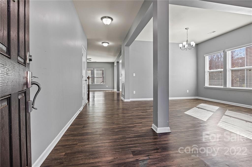 6170 Durango Way Denver, NC 28037 - Photo 3 of 38 a view of a hallway with wooden floor and stair