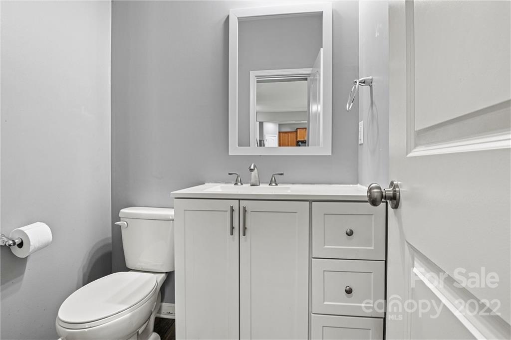 6170 Durango Way Denver, NC 28037 - Photo 33 of 38 a bathroom with a sink a toilet and vanity