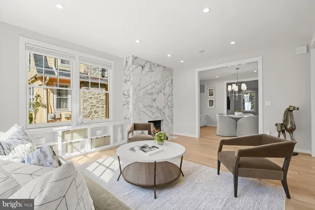 a living room with furniture and windows