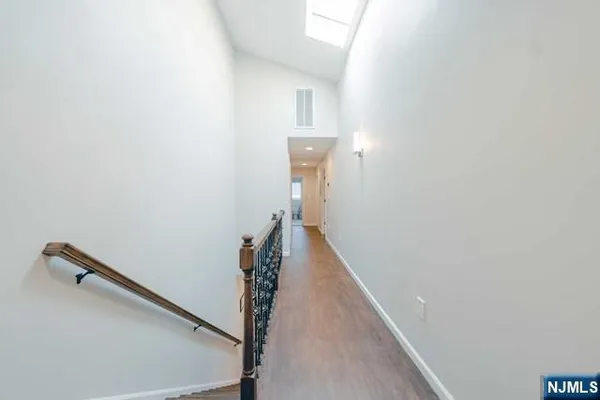 a view of a hallway with a white walls
