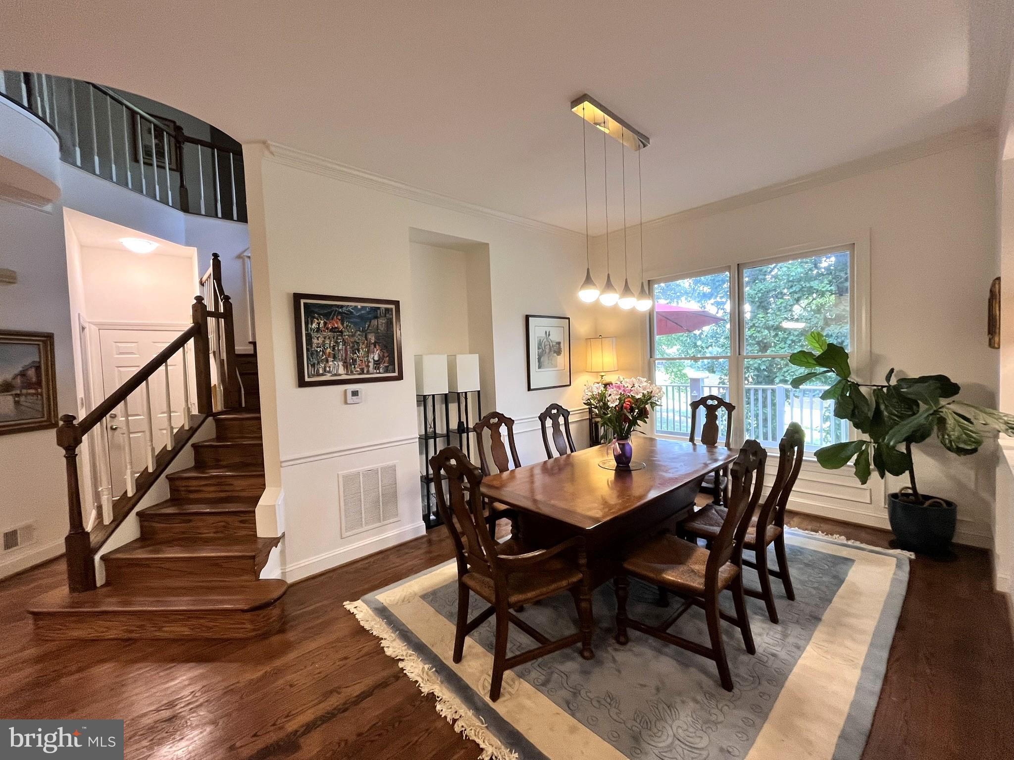7809 Fox Gate Court Bethesda, MD 20817 - Photo 11 of 42 a view of a dining room with furniture window and wooden floor