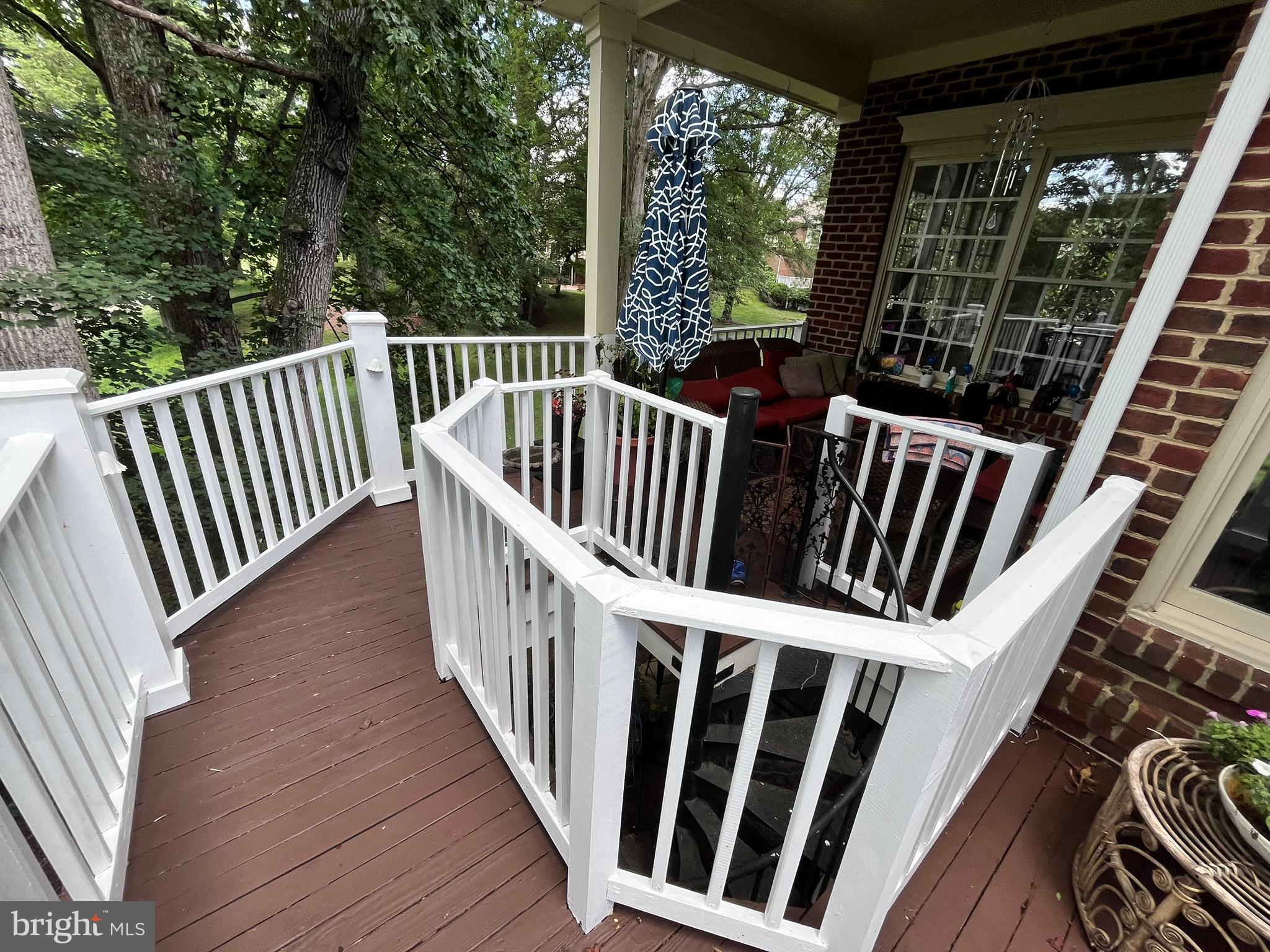 7809 Fox Gate Court Bethesda, MD 20817 - Photo 17 of 42 a view of balcony with wooden floor