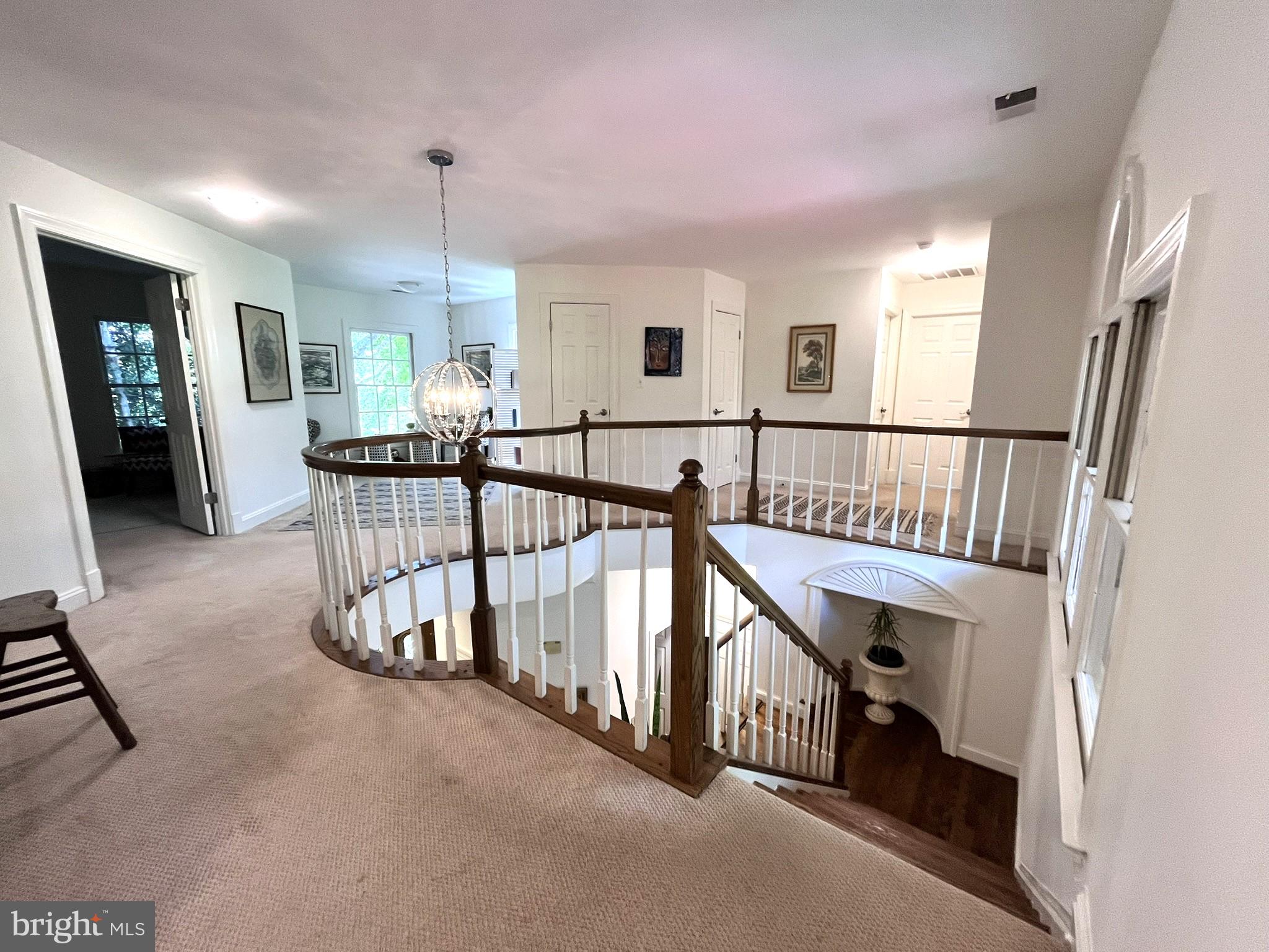 7809 Fox Gate Court Bethesda, MD 20817 - Photo 19 of 42 a view of staircase with furniture and a window