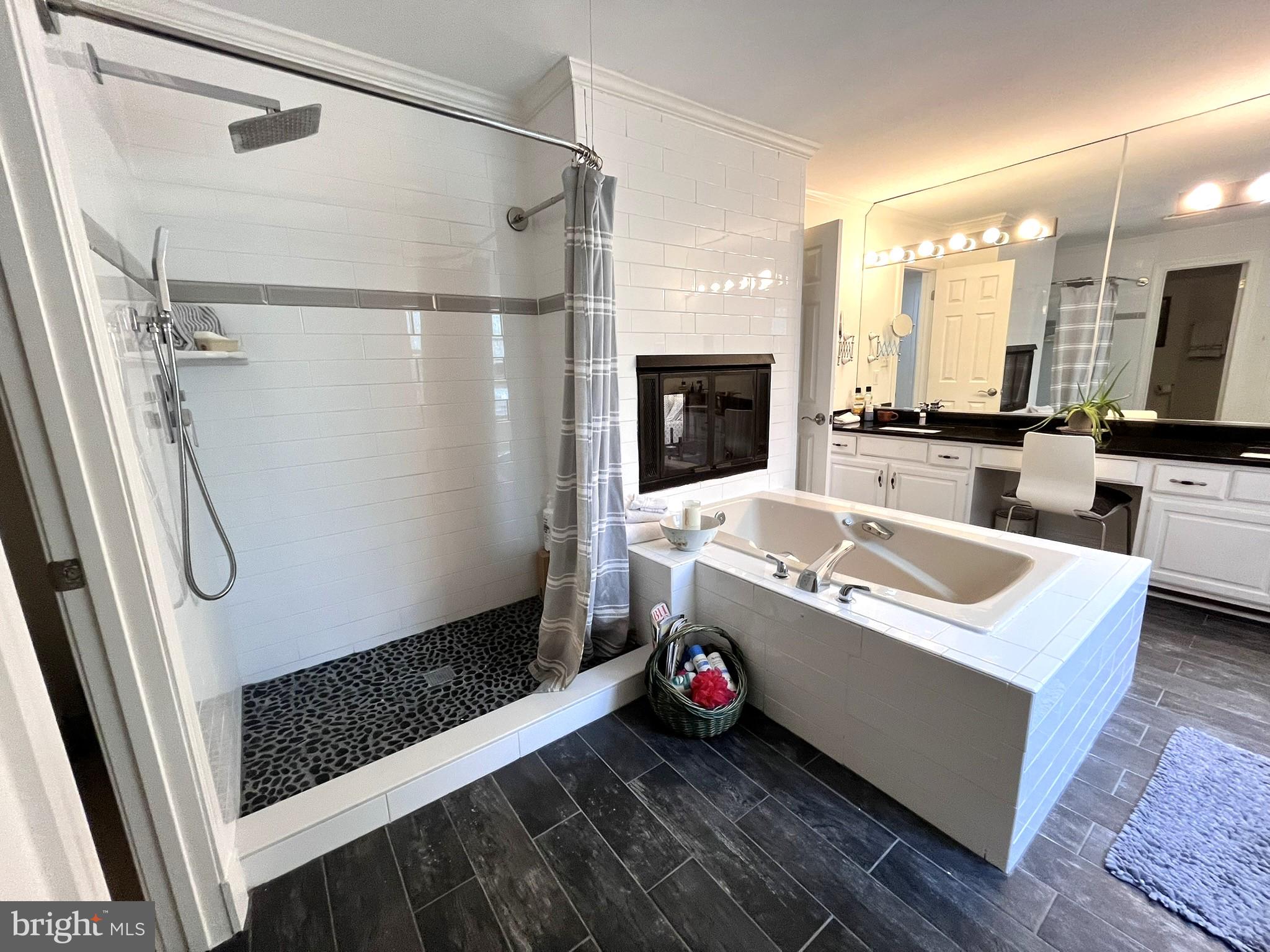 7809 Fox Gate Court Bethesda, MD 20817 - Photo 24 of 42 a bathroom with a tub a sink and a shower
