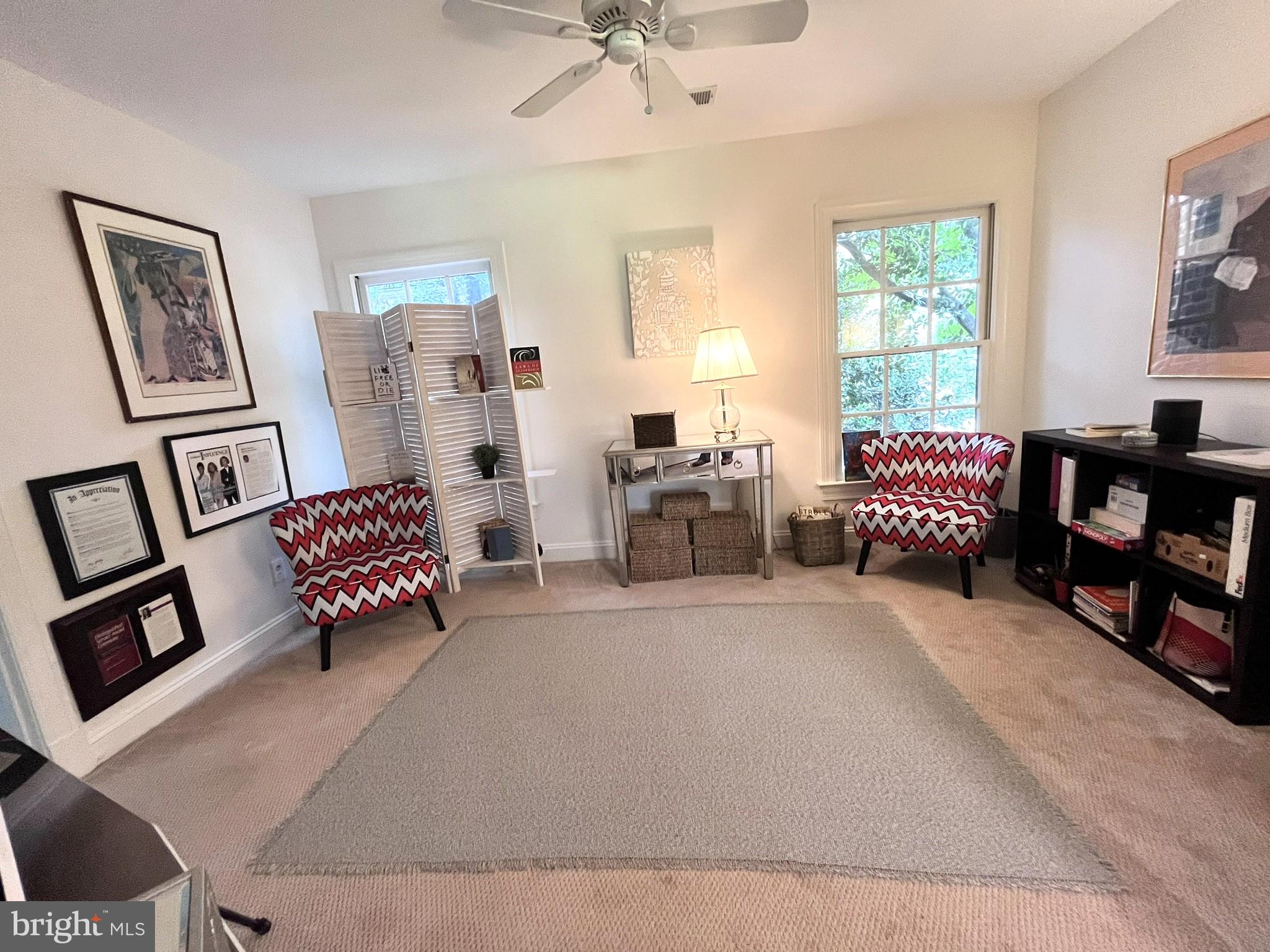 7809 Fox Gate Court Bethesda, MD 20817 - Photo 26 of 42 a living room with furniture and a book shelf