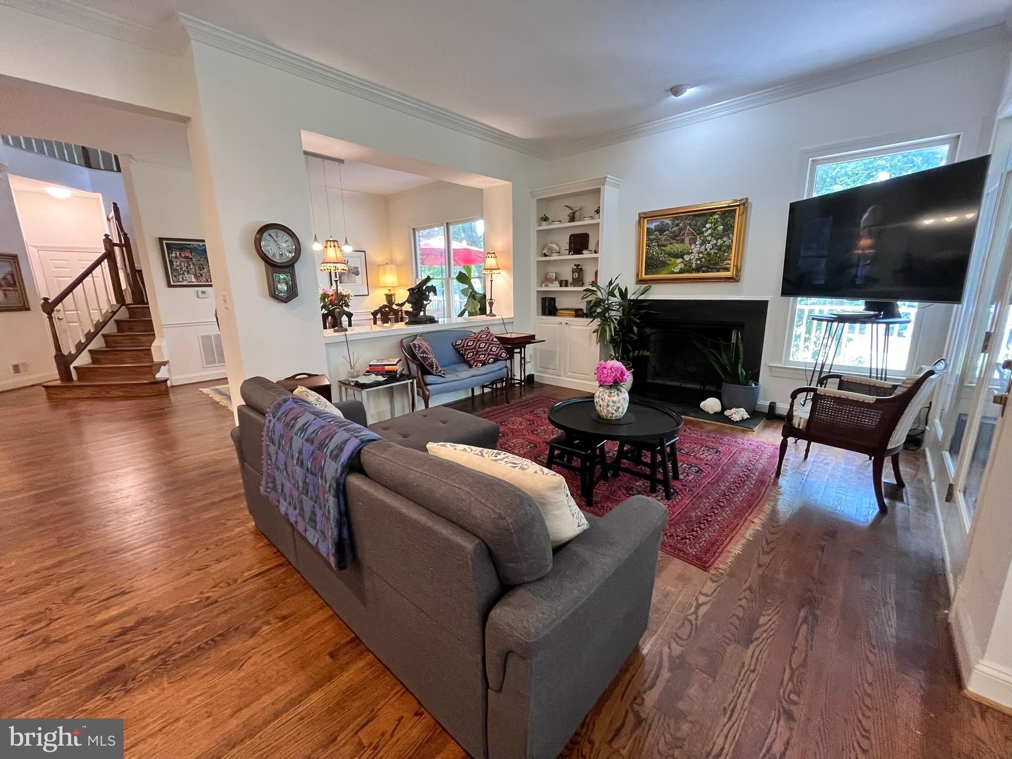 7809 Fox Gate Court Bethesda, MD 20817 - Photo 9 of 42 a living room with furniture flat screen tv and wooden floor