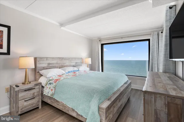 a bedroom with a bed and a night stand