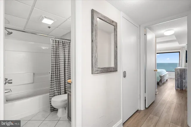 a bathroom with a toilet a sink and shower