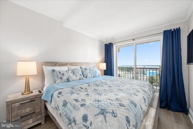 a bedroom with a bed and a lamp