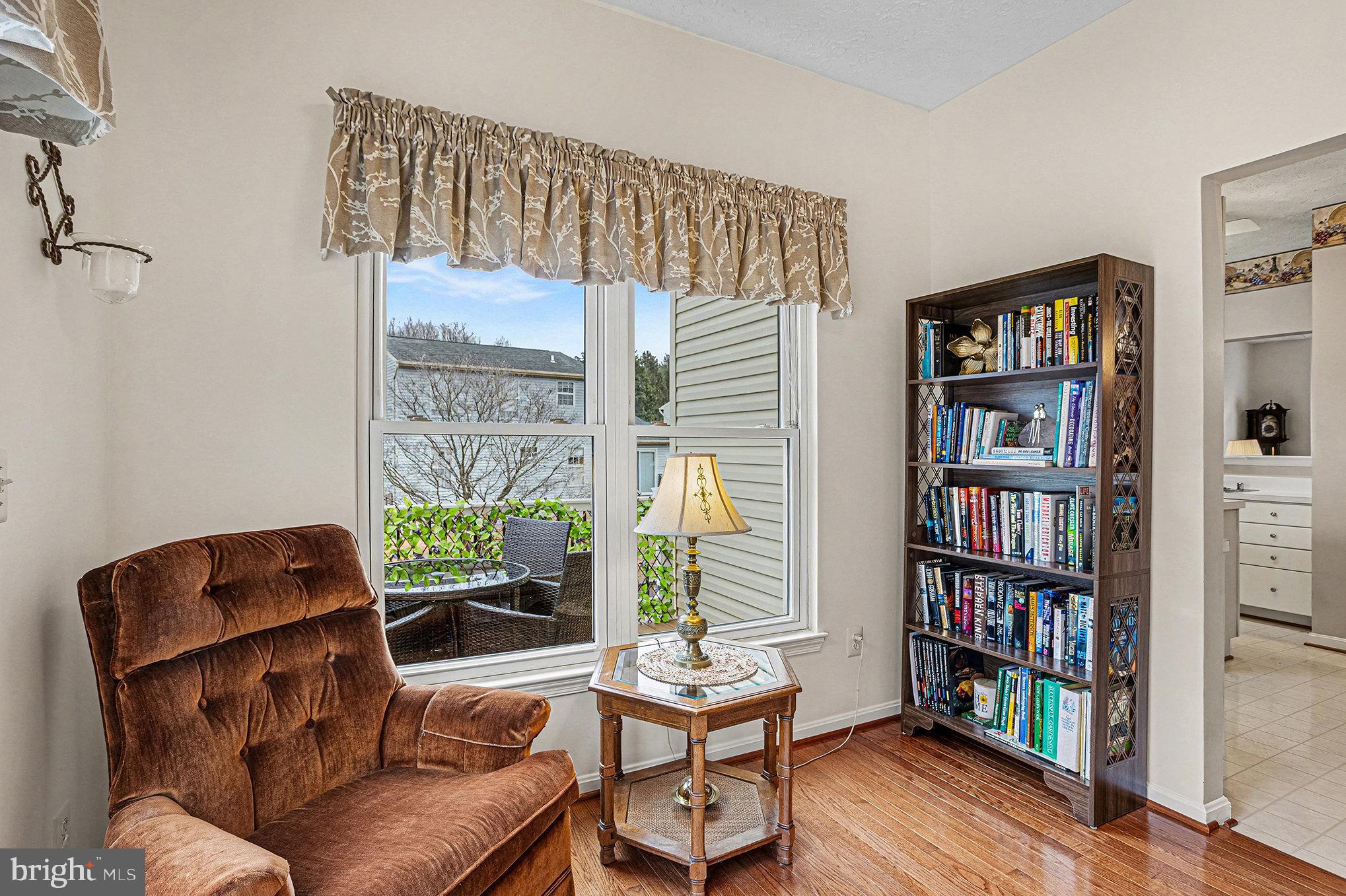 22 Oaksylvan Way Baltimore, MD 21236 - Photo 13 of 39 a living room with furniture and a book shelf