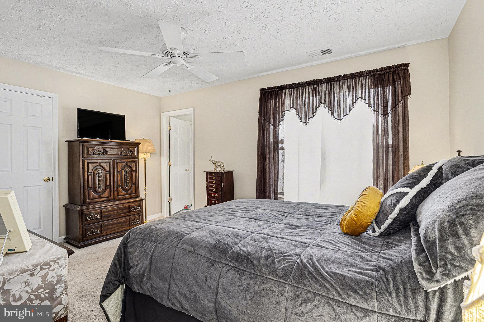 22 Oaksylvan Way Baltimore, MD 21236 - Photo 15 of 39 a bedroom with a bed and a television