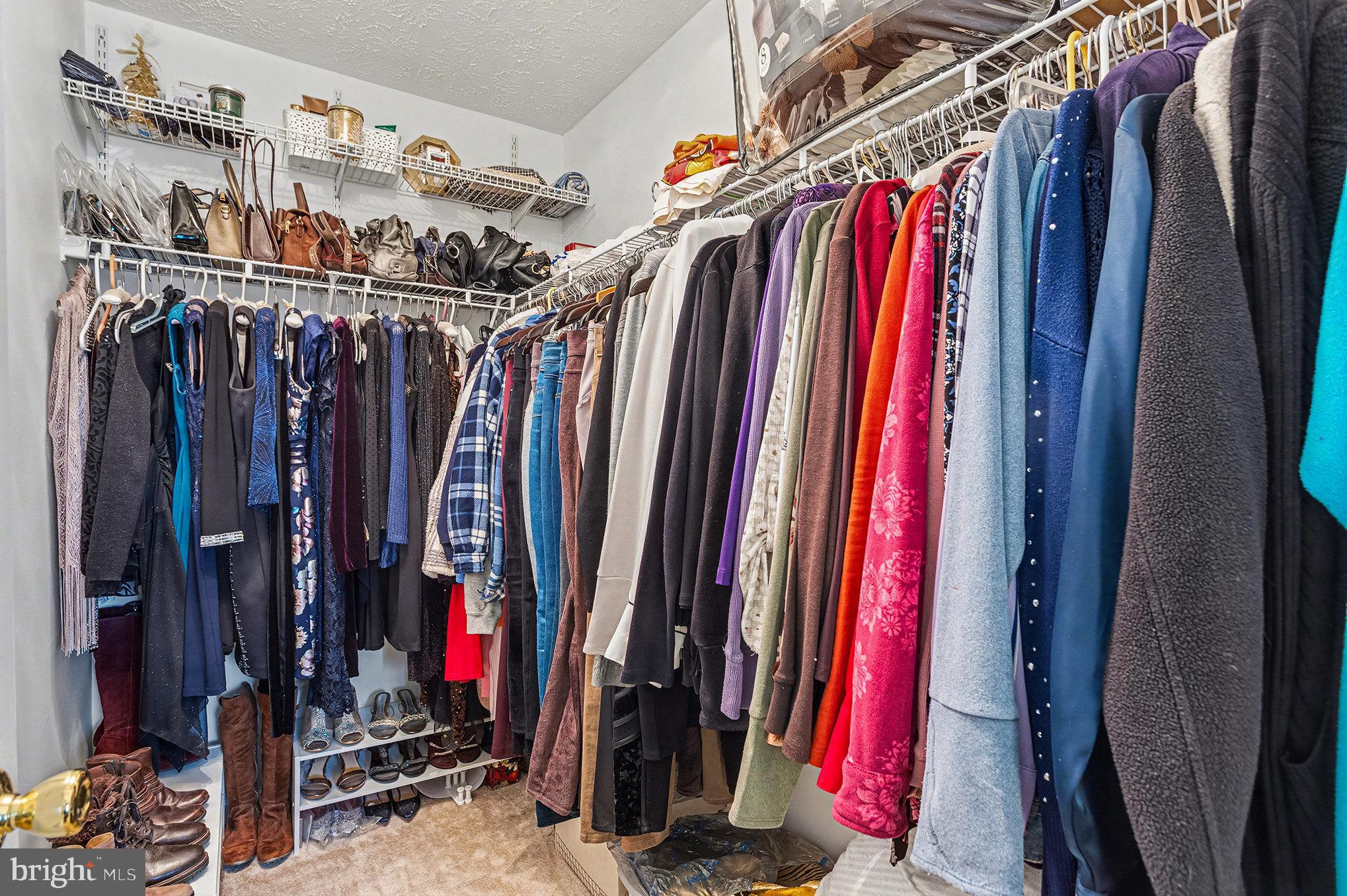 22 Oaksylvan Way Baltimore, MD 21236 - Photo 16 of 39 a view of walk in closet with clothes