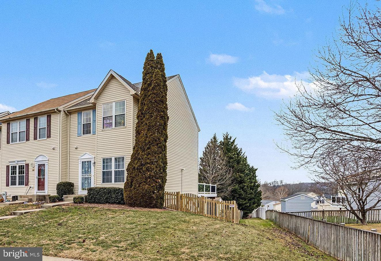 22 Oaksylvan Way Baltimore, MD 21236 - Photo 2 of 39 a front view of a house with a yard