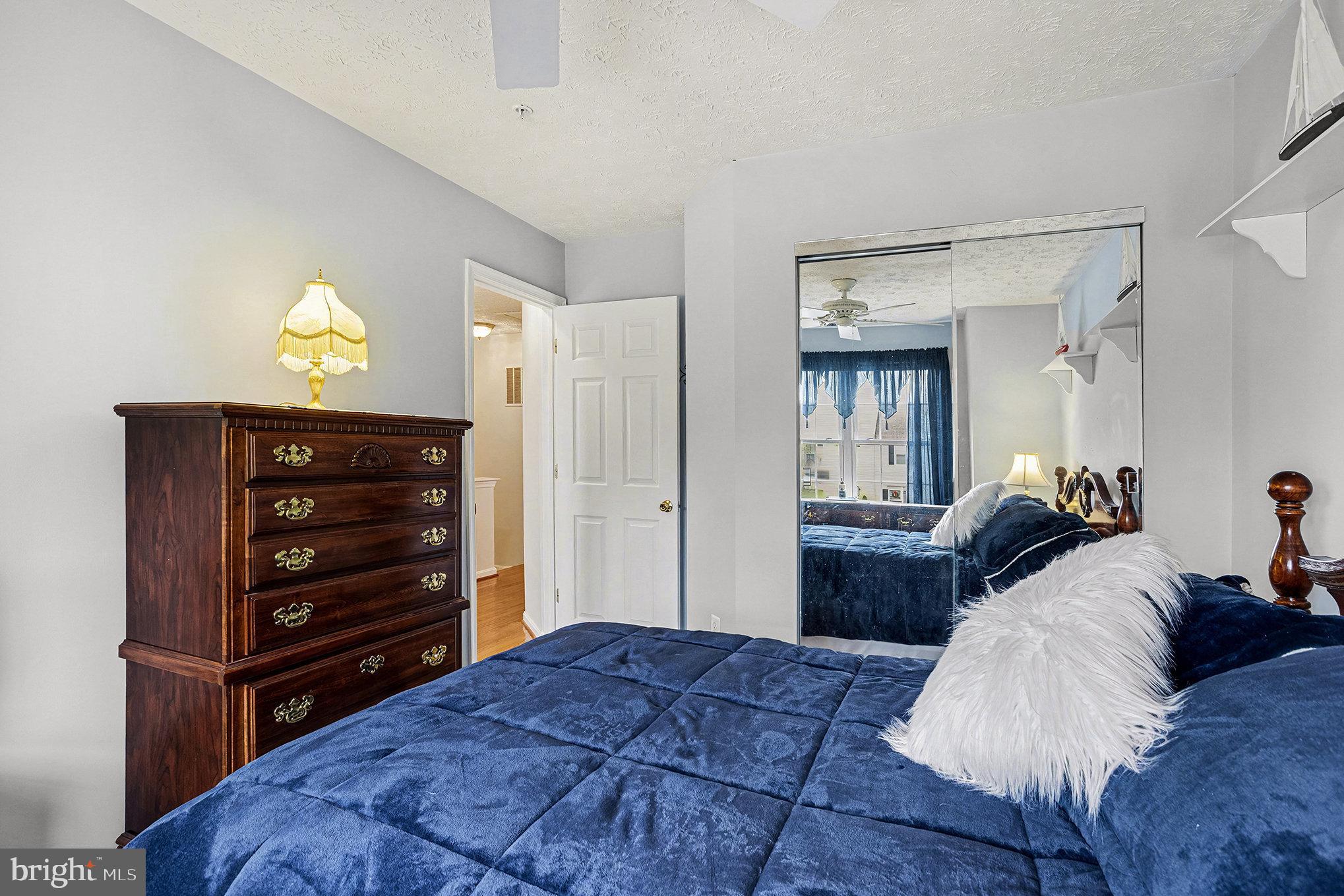 22 Oaksylvan Way Baltimore, MD 21236 - Photo 21 of 39 a bedroom with a bed and a dresser