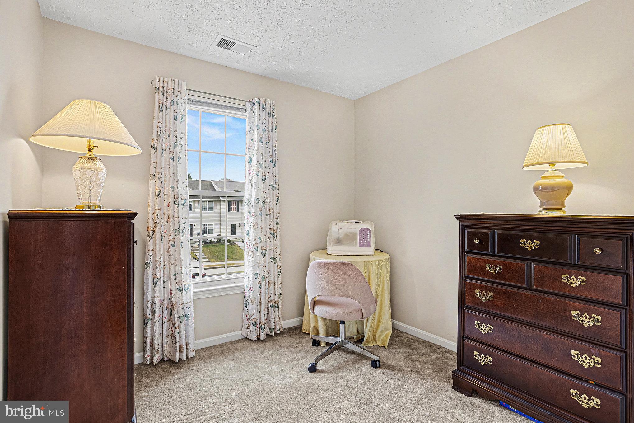 22 Oaksylvan Way Baltimore, MD 21236 - Photo 23 of 39 a view of a workspace with furniture and a window