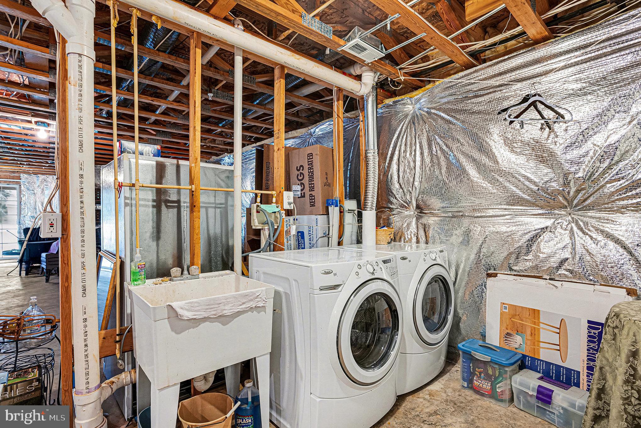 22 Oaksylvan Way Baltimore, MD 21236 - Photo 33 of 39 a utility room with dryer and washer