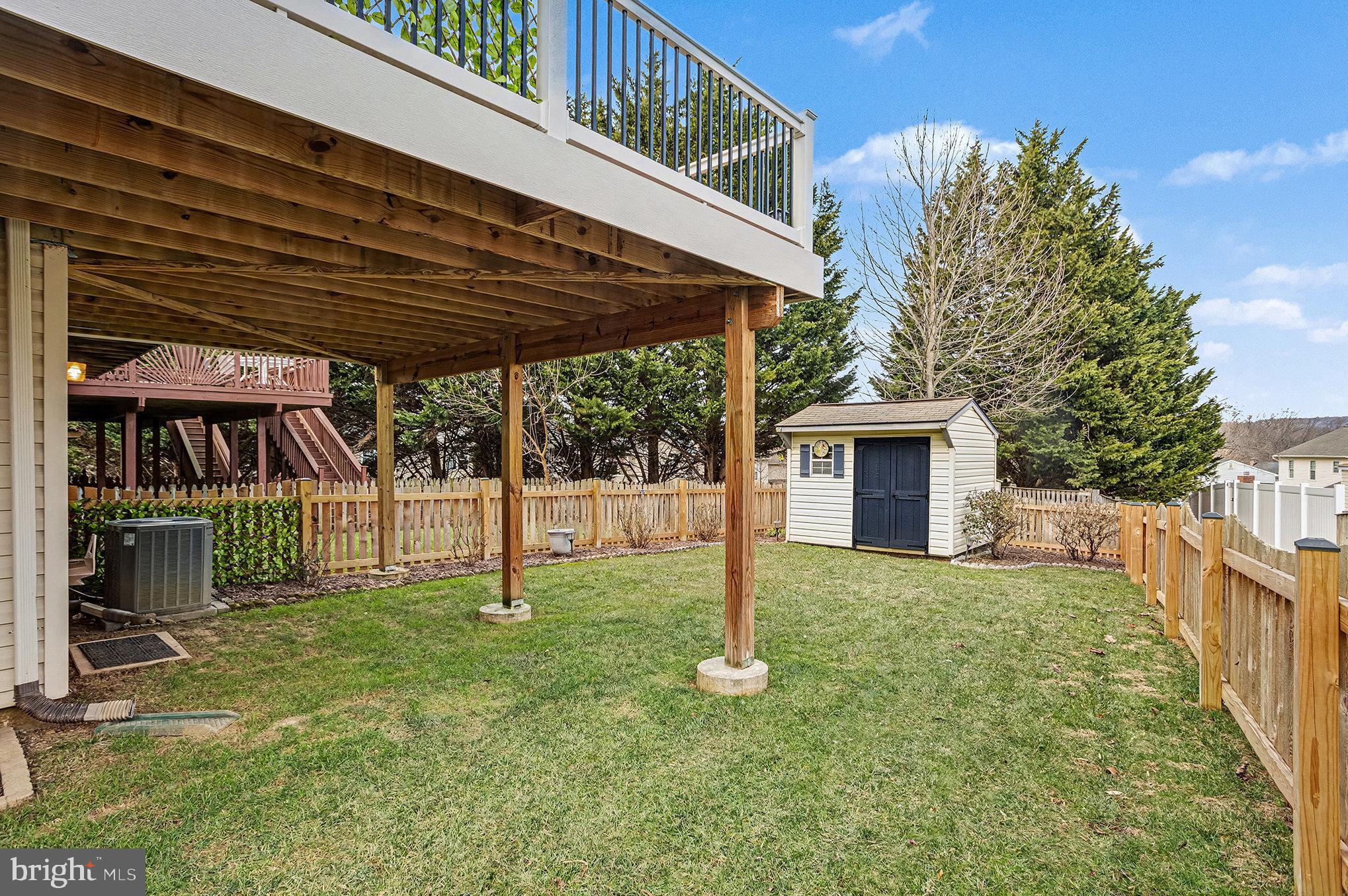22 Oaksylvan Way Baltimore, MD 21236 - Photo 34 of 39 a view of a house with backyard and a tree