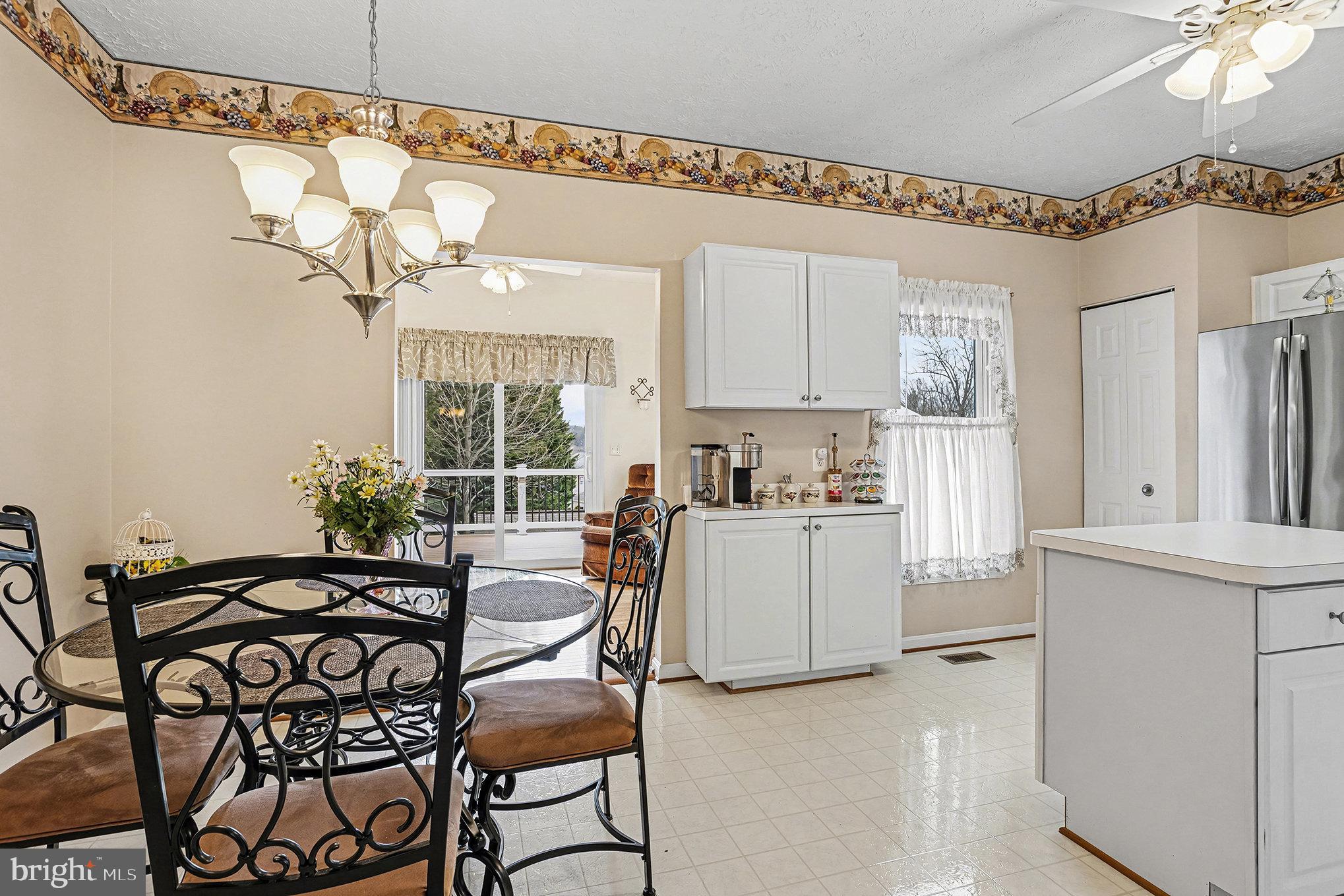 22 Oaksylvan Way Baltimore, MD 21236 - Photo 6 of 39 a view of a dining room with furniture window and outside view
