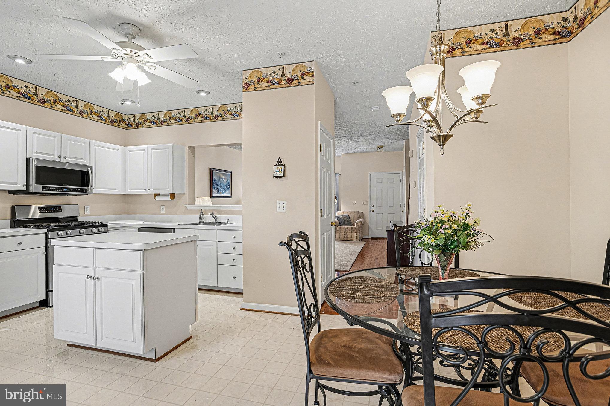 22 Oaksylvan Way Baltimore, MD 21236 - Photo 10 of 39 a dining room with furniture and chandelier