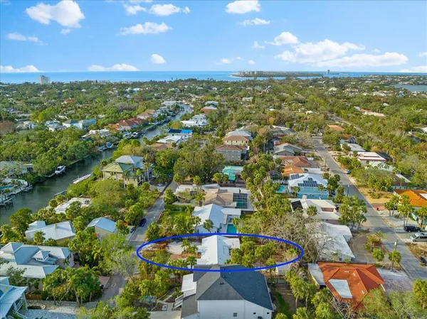an aerial view of residential houses with outdoor space