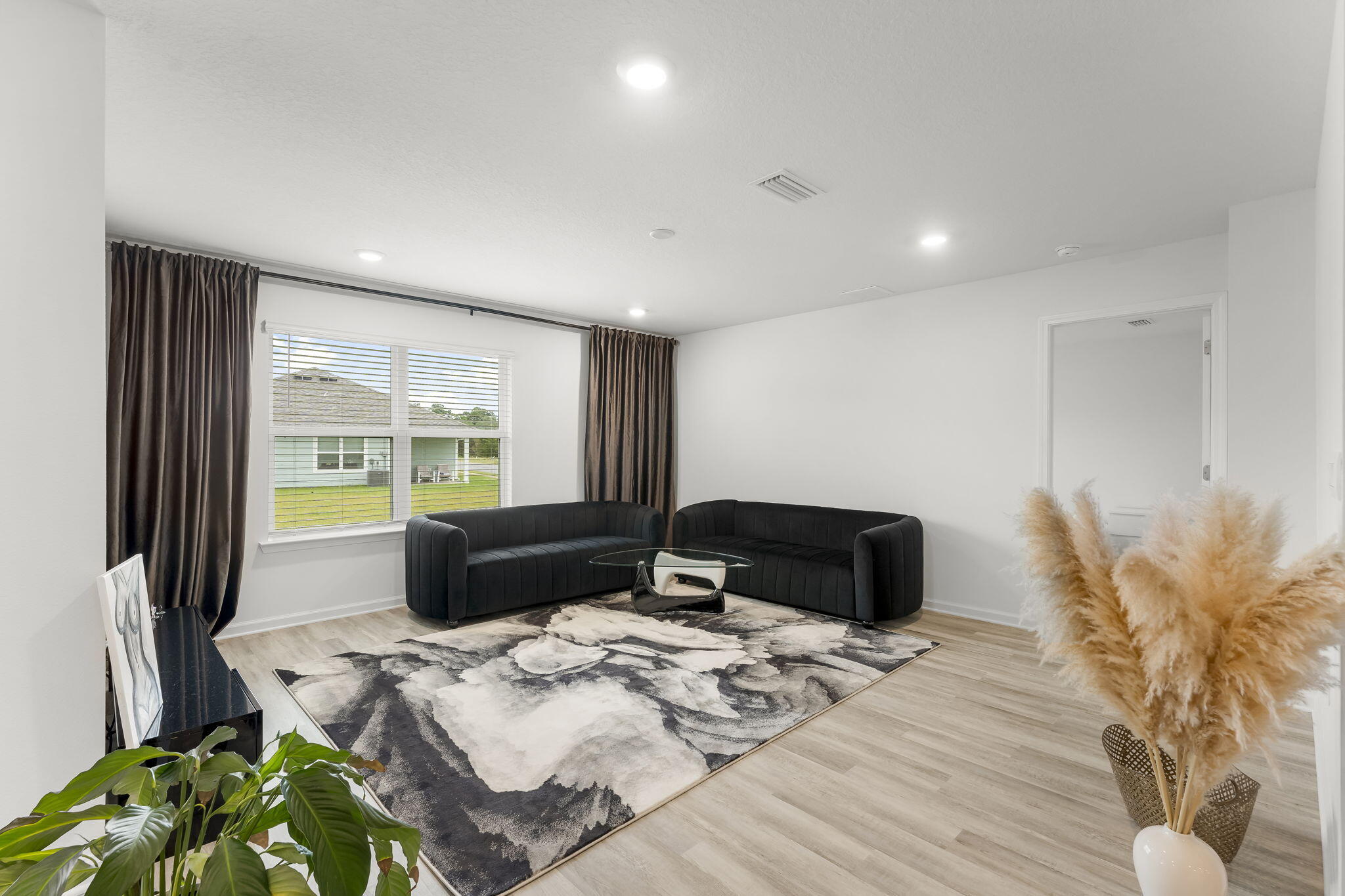 255 Riverwalk Circle Freeport, FL 32439 - Photo 12 of 40 a bedroom with a bed window and mirror