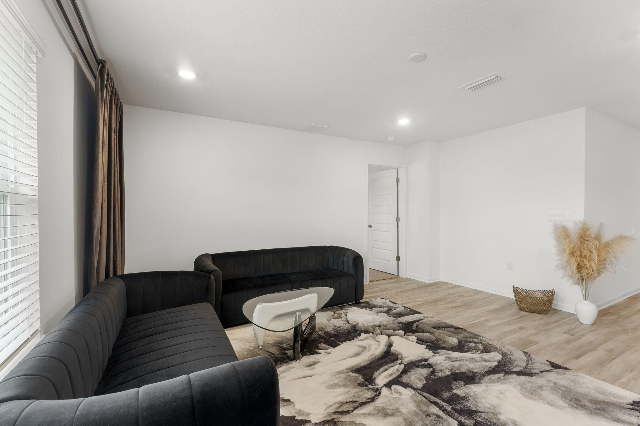 255 Riverwalk Circle Freeport, FL 32439 - Photo 14 of 40 a bedroom with a bed and a couch