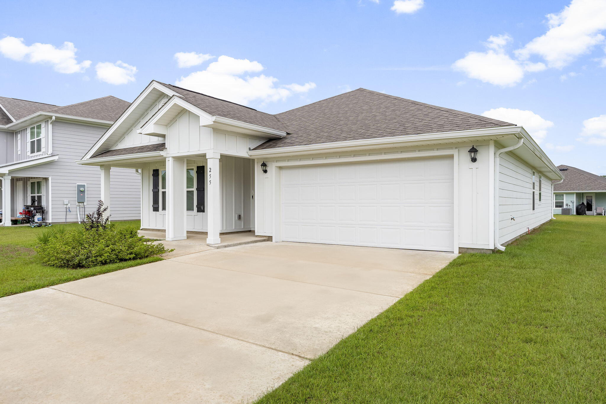 255 Riverwalk Circle Freeport, FL 32439 - Photo 2 of 40 a front view of a house with yard