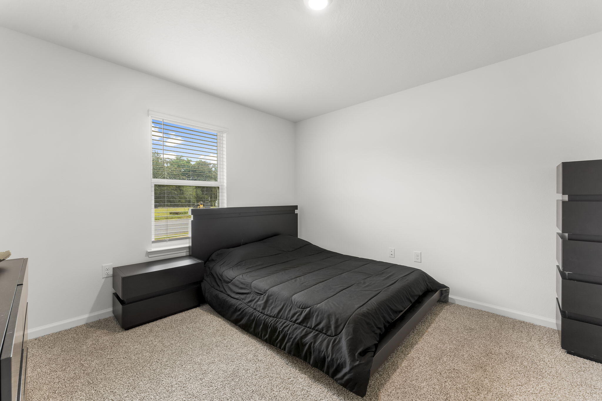 255 Riverwalk Circle Freeport, FL 32439 - Photo 22 of 40 a bedroom with a bed and a window