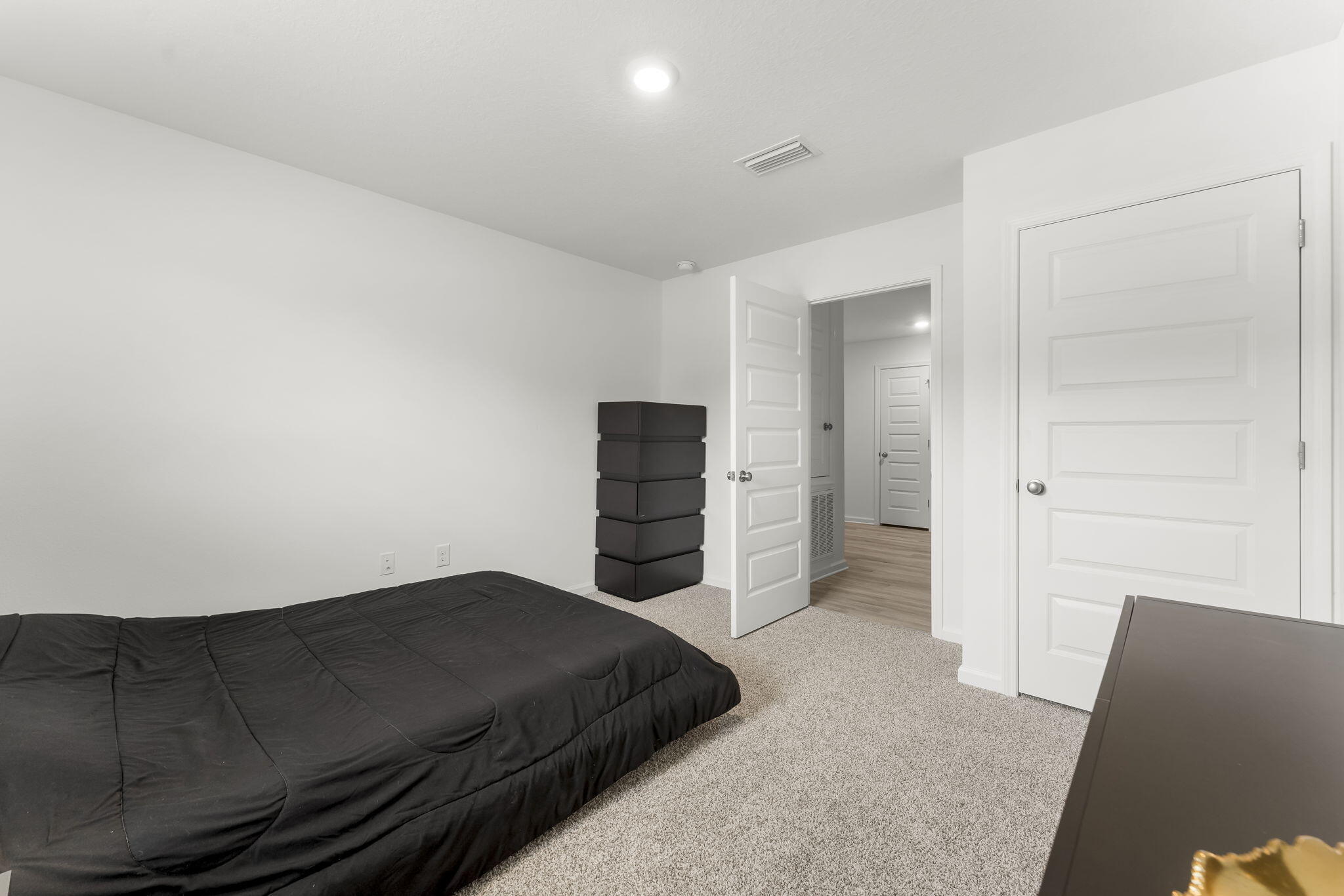 255 Riverwalk Circle Freeport, FL 32439 - Photo 23 of 40 a bedroom with a bed and cabinet