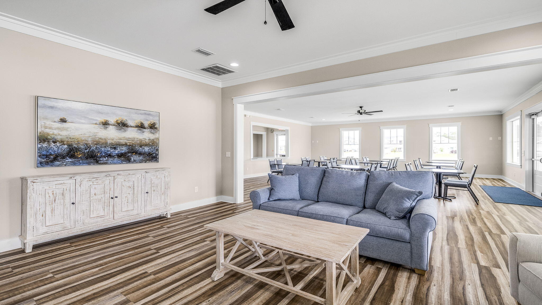 255 Riverwalk Circle Freeport, FL 32439 - Photo 33 of 40 a living room with furniture and painting on the wall
