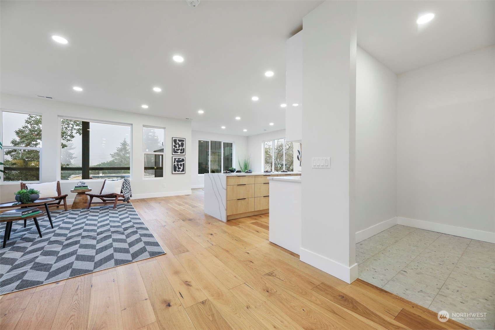 11639 Beacon Avenue South Seattle, WA 98178 - Photo 16 of 35 a view of a living room kitchen and a wooden floor
