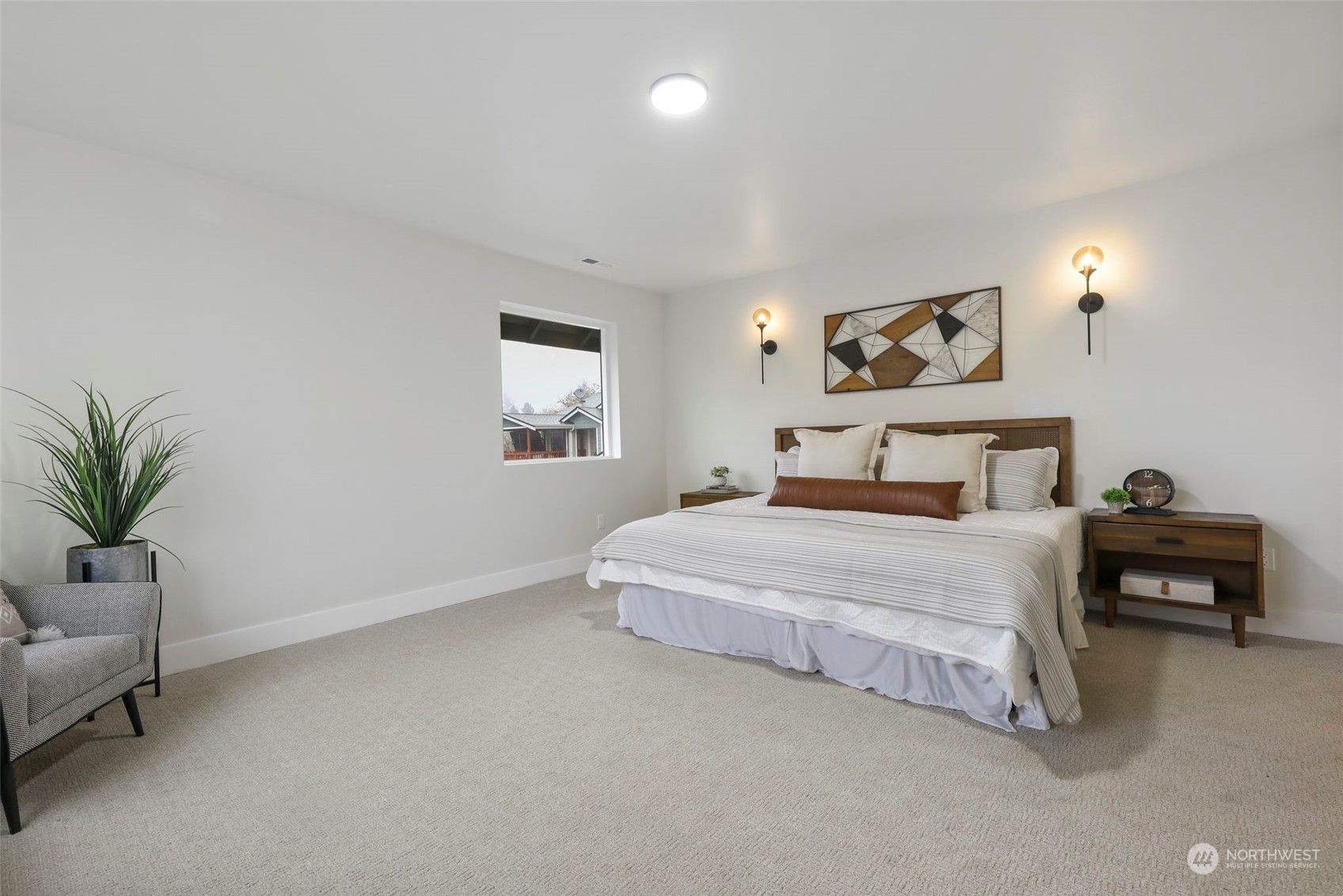 11639 Beacon Avenue South Seattle, WA 98178 - Photo 19 of 35 a bedroom with a bed and a potted plant