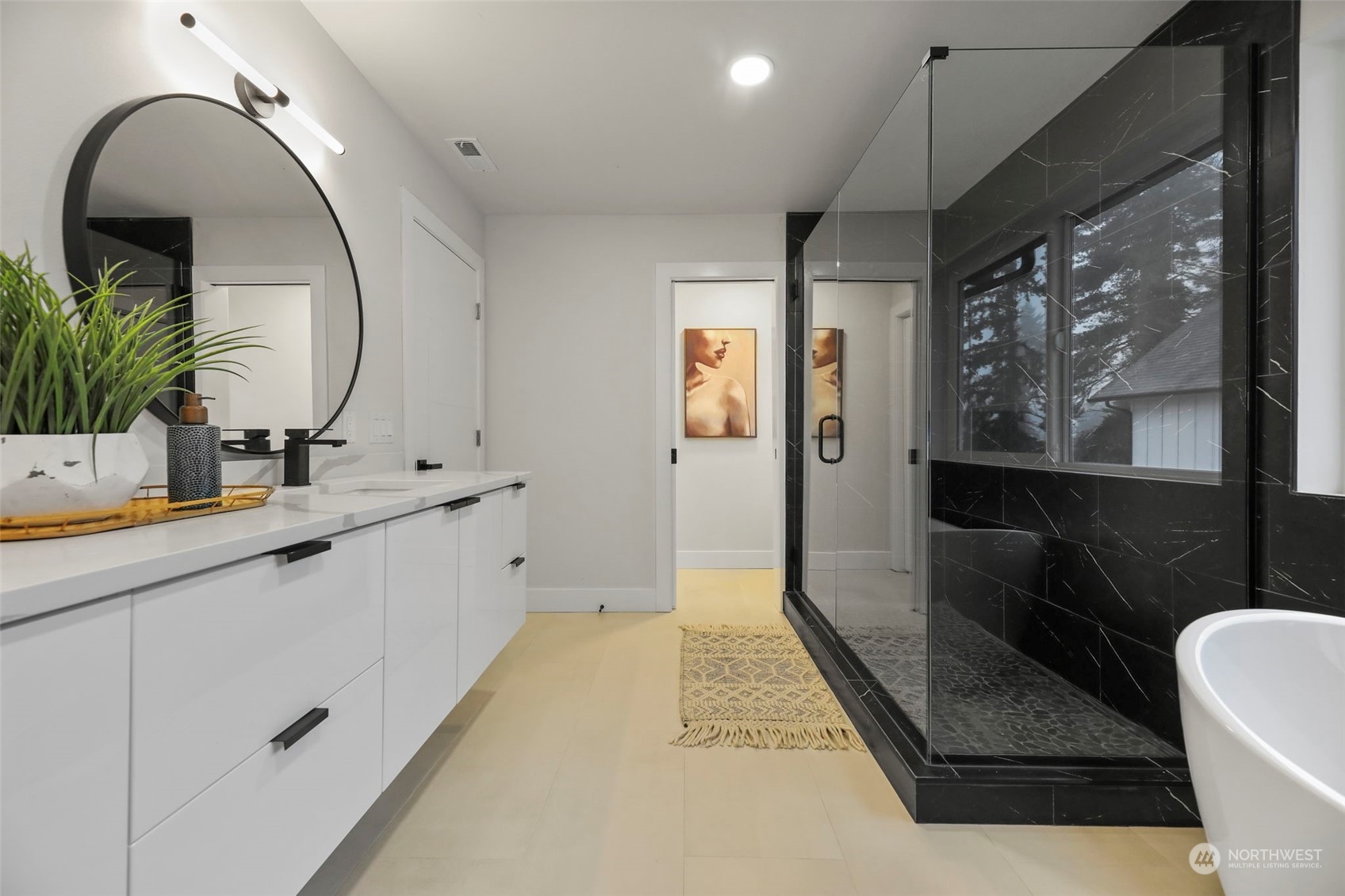 11639 Beacon Avenue South Seattle, WA 98178 - Photo 25 of 35 a bathroom with a double vanity sink a mirror and a shower