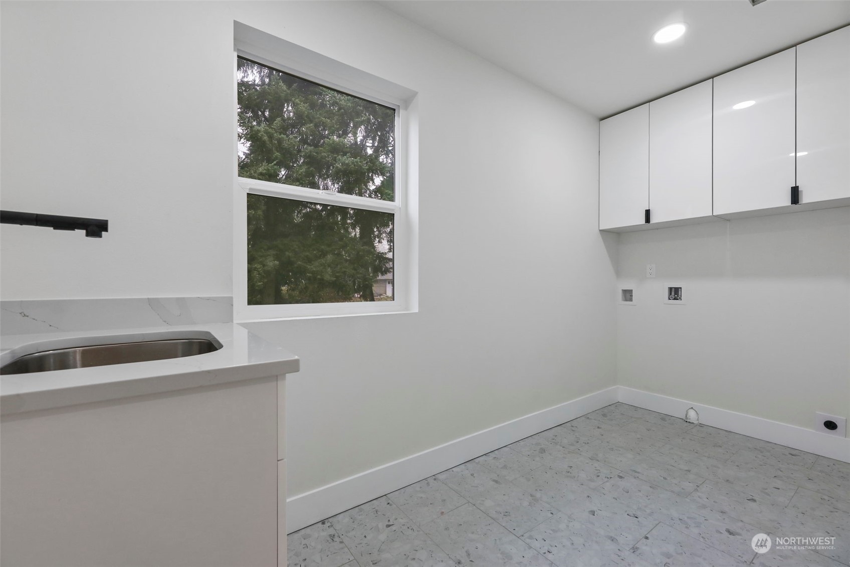 11639 Beacon Avenue South Seattle, WA 98178 - Photo 27 of 35 a room with a sink and cabinets