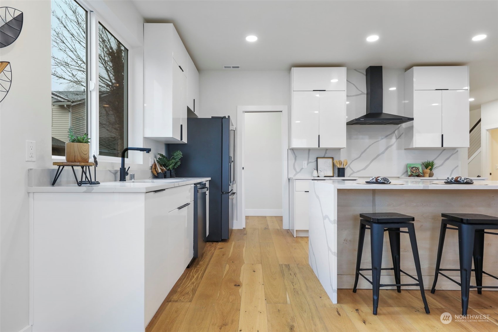 11639 Beacon Avenue South Seattle, WA 98178 - Photo 8 of 35 a kitchen with white cabinets and refrigerator