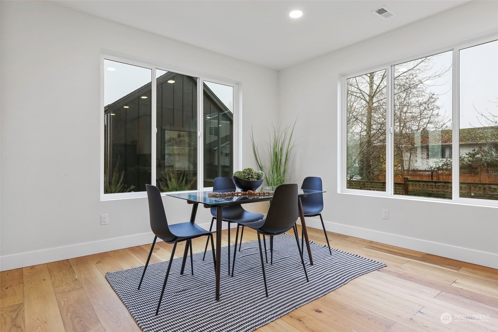 11639 Beacon Avenue South Seattle, WA 98178 - Photo 10 of 35 a dining room with furniture and wooden floor