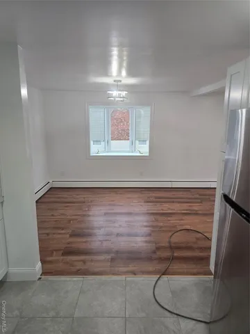 a kitchen with a stove a sink and a refrigerator
