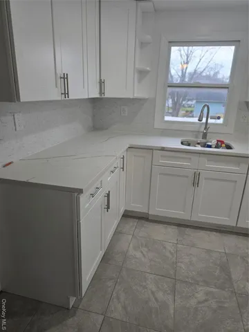 a view of a room with wooden floor and staircase