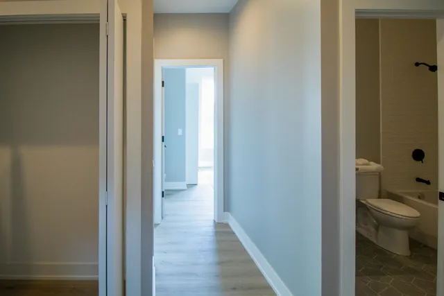 a view of a bathroom from the hallway